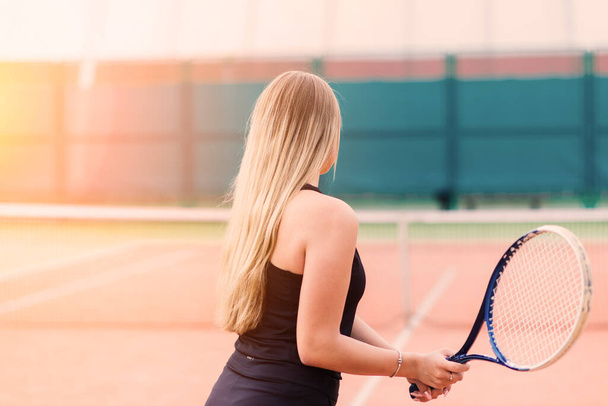 Tennis tournament. Female player at clay tennis court - Photo, Image