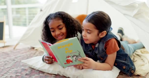 Girl, story book and reading together, sisters at home with bonding and education, literature and fantasy. Development, learning and young female children, childhood and relax with storytelling. - Footage, Video