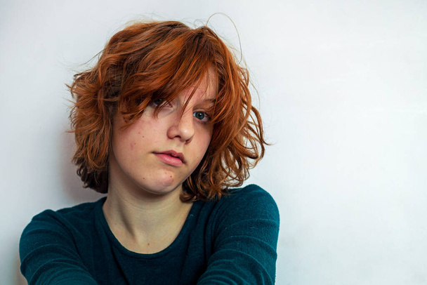 beautiful teenage girl with red anime hair on a light background - Photo, Image