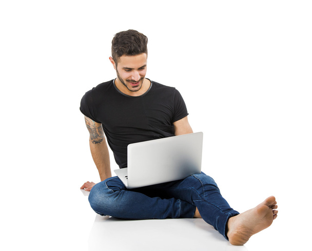 Man working with a laptop - Foto, Bild