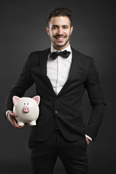 Rich man with  pig money box - Foto, Bild