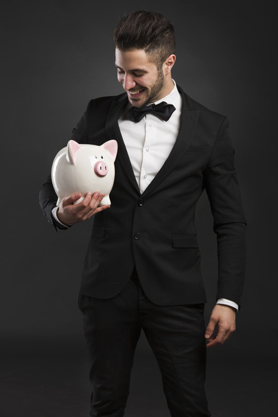 Rich man with  pig money box - Fotoğraf, Görsel