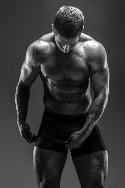 Man with great body posing in studio - Photo, Image