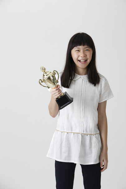 girl holding trophy - Фото, изображение