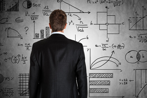 Businessman in front of math formulas - Photo, image