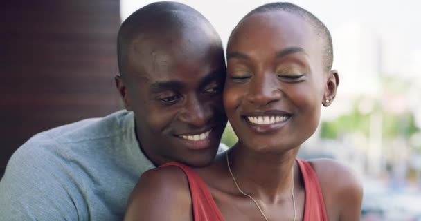 Love, hug and couple holding hands on a balcony with care, support and security in their home together. Happy, embrace and black people cuddle in a house with romance, bonding and soulmate connection. - Footage, Video