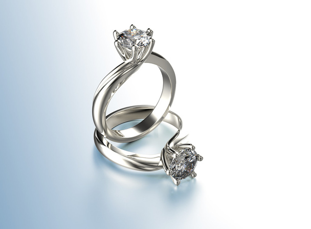 ダイヤモンドと黄金の婚約指輪 - 写真・画像