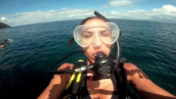 Scuba diving, woman and diving underwater in ocean for adventure, travel and freedom on holiday or vacation. Diver, person and snorkeling in sea with gear for travel, undersea exploration or happy. - Video