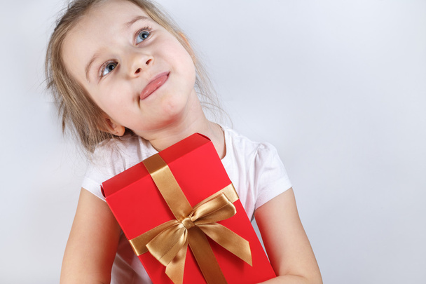 Child with a gift - Zdjęcie, obraz