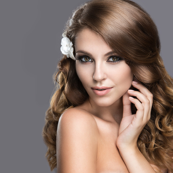 Portrait of a beautiful woman in the image of the bride with flowers in her hair. Beauty face - Foto, immagini