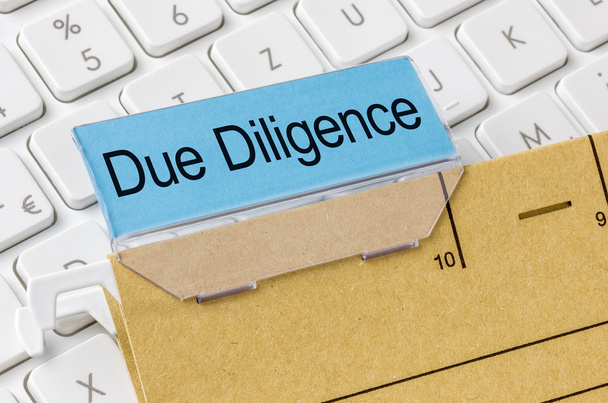 A brown file folder labeled with Due Diligence - Photo, Image