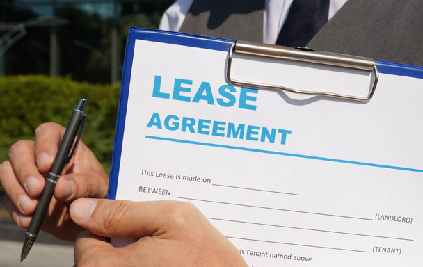 Concept of commercial, lease, tenancy, contract, property or commercial laws: the first page of lease agreement. - Photo, Image