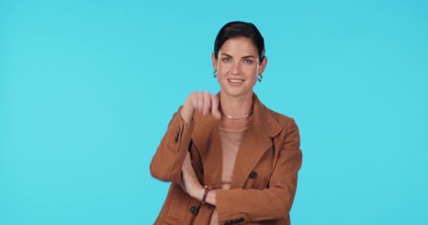 Business woman, loser sign and tongue out in studio for mocking, winning or fun humour. Portrait of female model show emoji on forehead for competition, funny face or gesture on a blue background. - Footage, Video
