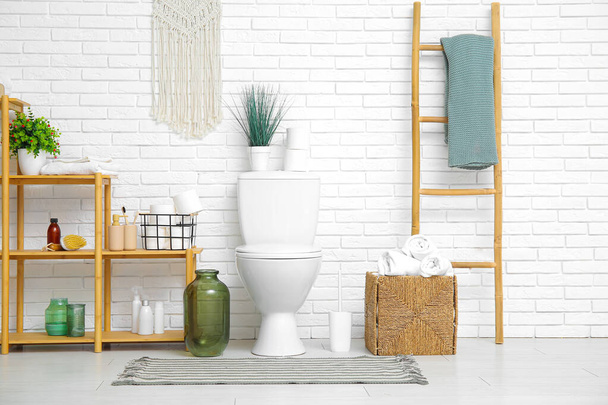 Stylish interior of restroom with toilet paper rolls - Photo, Image