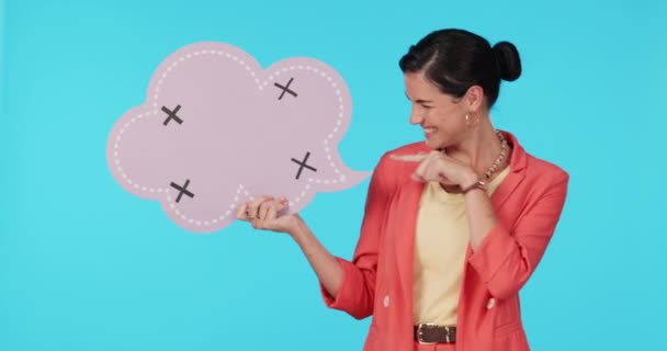 Happy, pointing and a woman with a speech bubble on a blue background for communication. Excited, talk and face portrait of a social media manager with a board and gesture for a chat or quote. - Footage, Video