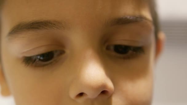 Close up on sad child boy eyes. SLow motion. High quality 4k footage - Footage, Video