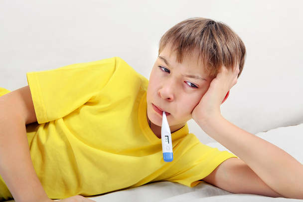 Sick Teenager with Thermometer - Foto, immagini