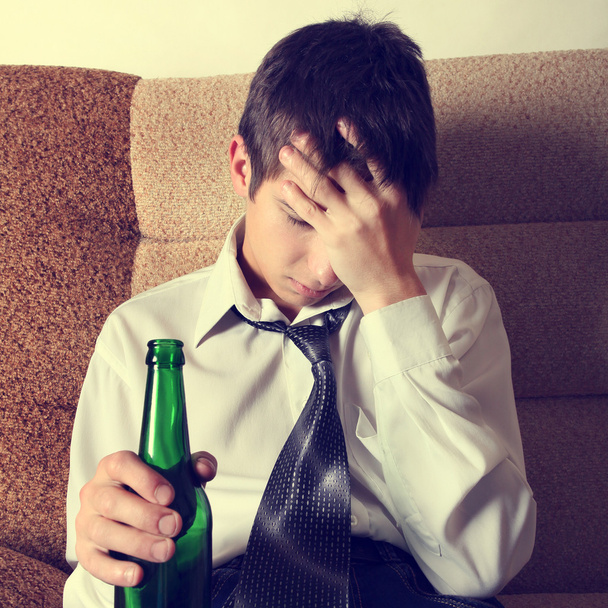 Sad Young Man with a Beer - 写真・画像