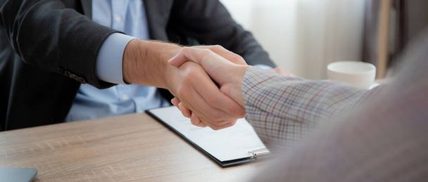 Young asian businesswoman job interview with caucasian manager and agreement with handshake at office, hr director interview with recruitment personnel and shaking hands, manager and partner. - Photo, Image