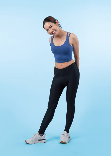Full body asian woman in sportswear portrait, smiling and posing cheerful gesture. Workout training with attractive girl engage in her pursuit of healthy lifestyle. Isolated background Vigorous - Photo, Image