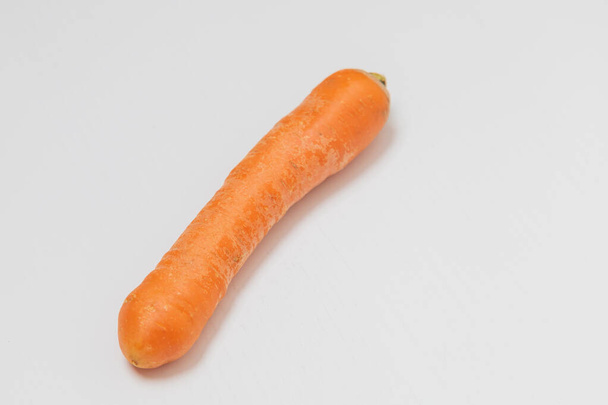 Raw unpeeled washed carrots on a white background - Photo, Image