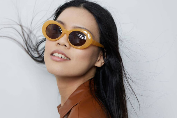 Femininity woman portrait hair black attractive sunglasses glamour face salon lifestyle hat travel beautiful cosmetic fashion beige vacations asian model hair beauty cute - Photo, Image