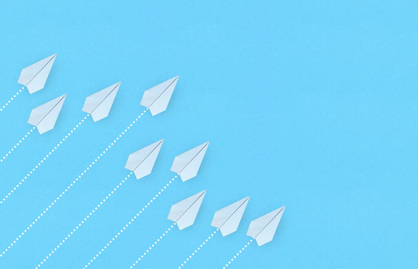 White paper planes on blue background. Business competition concept - Photo, Image