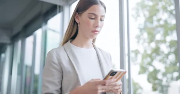 Typing, walking and a woman with a phone at work for communication, email or reading a notification. Social media, chat and a corporate employee in an office with a mobile for an app or the internet. - Footage, Video