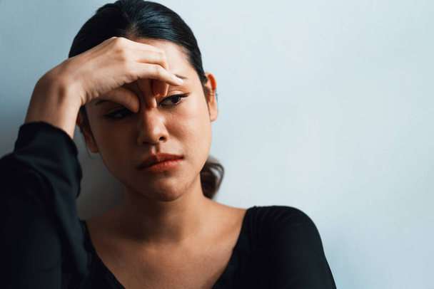 Depressed young Asian woman with mental health problem in mind need uttermost treatment from overthinking fatigue, disruptive thought, dissocial, anxiety and other mental health disorders . - Photo, Image