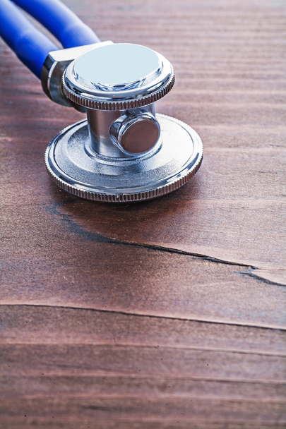 Стетоскоп на деревянной доске
 - Фото, изображение