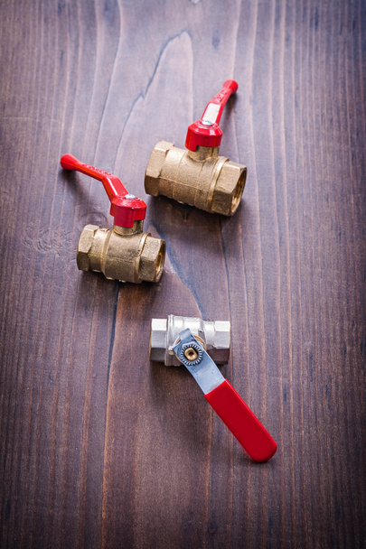Plumbers fixtures with red handles - Fotoğraf, Görsel