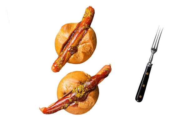 Deutsche Bockwurst sausage in a bun with French fries and curry sauce, currywurst. Isolated, white background - Photo, Image