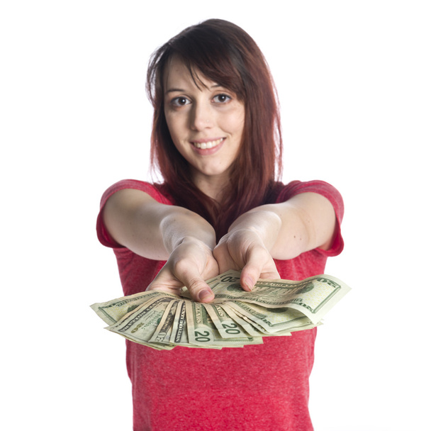 Smiling Woman Offering a Fan of 20 US Dollar Bills - 写真・画像