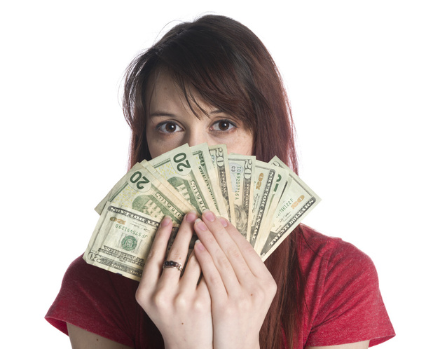 Woman Covering Half Face with 20 US Dollar Bills - 写真・画像