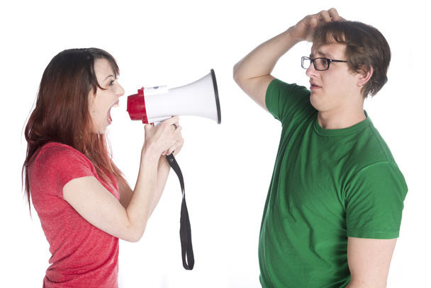 Woman Shouting to her Man with Megaphone - Foto, imagen