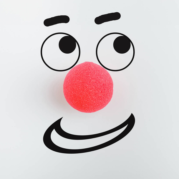 Red foam nose drawn clown eyes smile on a white background. Red nose day concept. - Photo, Image