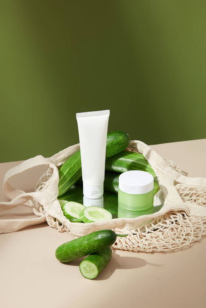 natural aloe vera cream, natural cosmetic products and green leaf on a wooden table. skin care and moisturizing. - Photo, Image