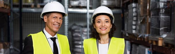 professional headshot banner, middle aged supervisor and female employee in hard hat with clipboard - Photo, Image
