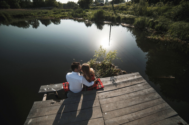 Beautiful couple  at the lake - Фото, зображення