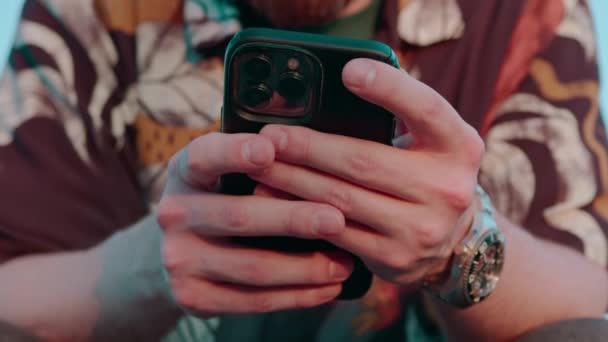 close-up of male hands holding smartphone texting via messenger online communication - Footage, Video
