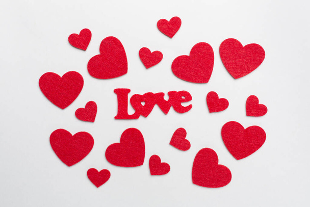 Felt word love with hearts on color background, top view - Foto, immagini