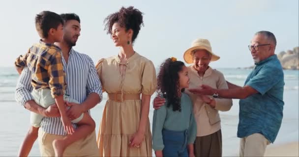 Big family, grandparents or happy kids talking in beach, sea or ocean on holiday vacation together. Mom, dad or children siblings bonding to relax for love, care or trust with grandma or grandfather. - Footage, Video
