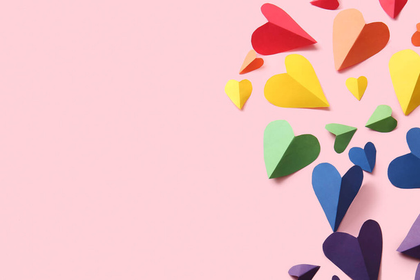 Colorful hearts made of paper on pink background. LGBT concept - Photo, Image