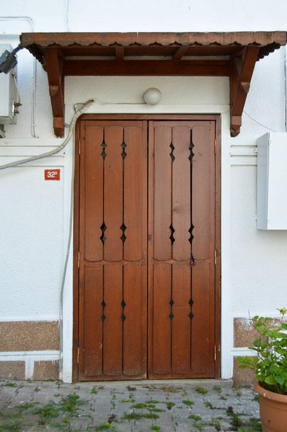 Old brown color wooden entrance door of house in Turkey Istanbul Buyukada - Photo, Image