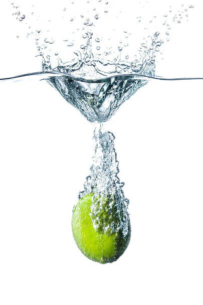 Fresh lime falling into water - Foto, Imagen
