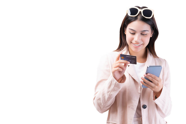 Businesswoman using mobile phone credit card for shopping online enjoy with social media online banking stand over white background Entrepreneur beautiful business young lady wear business suit - Photo, Image