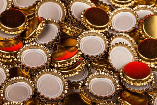 golden bottle caps  - Foto, afbeelding