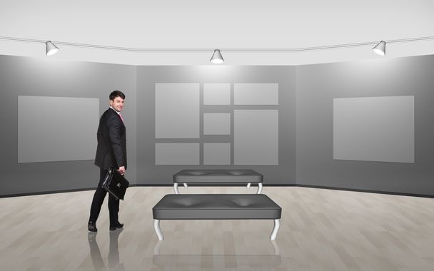 Businessman in gallery room - Photo, Image