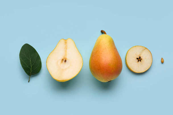Ripe pears on blue background - Photo, Image