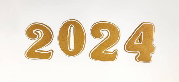 2024 új éve. Mézeskalács banner formájában számok 2024 fehér alapon - Fotó, kép
